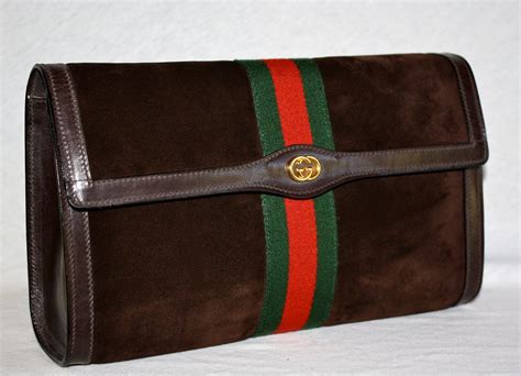 vintage gucci web clutch|Gucci vintage suede clutch.